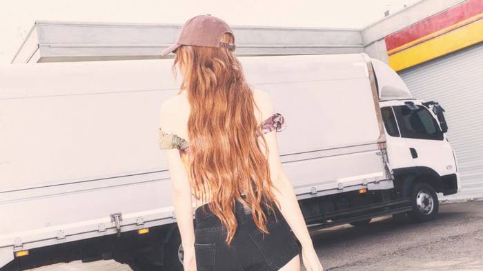 Nayeon from TWICE in front of a truck