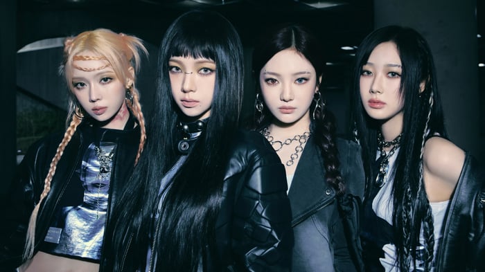 Aespa members Karina, Giselle, Winter, and Ningning in dark concept