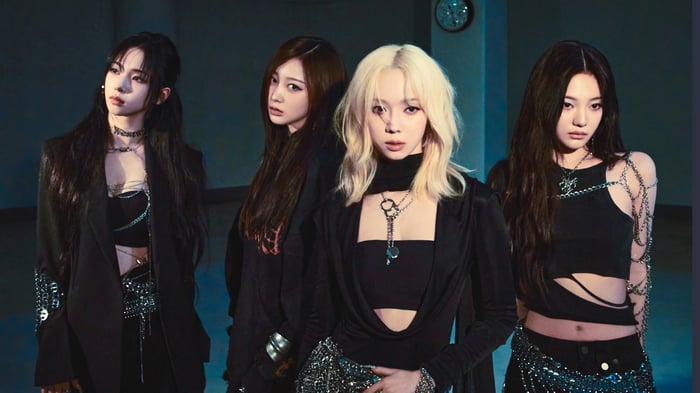 Aespa members Karina, Giselle, Winter, and Ningning in black outfits