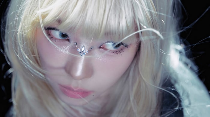 Karina from Aespa with face gems