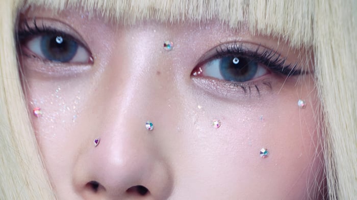 Giselle from Aespa with face gems