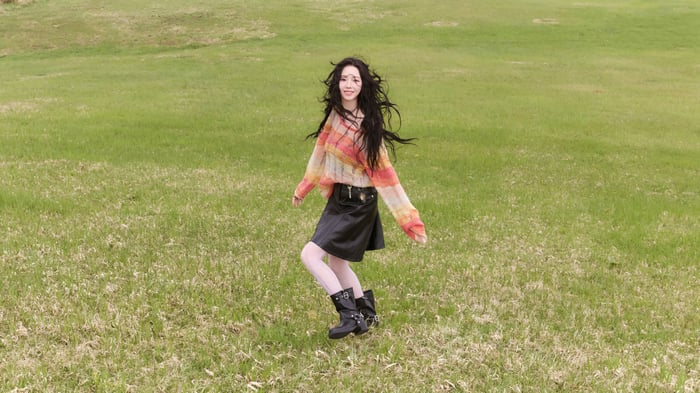 Karina from Aespa in a field