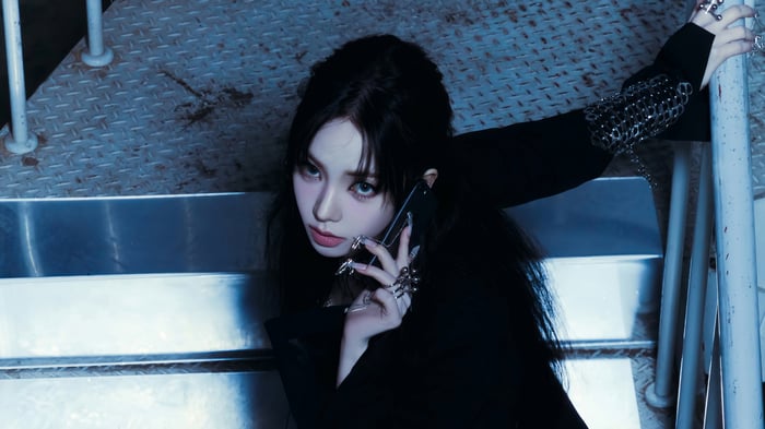 Karina from Aespa on a metal staircase