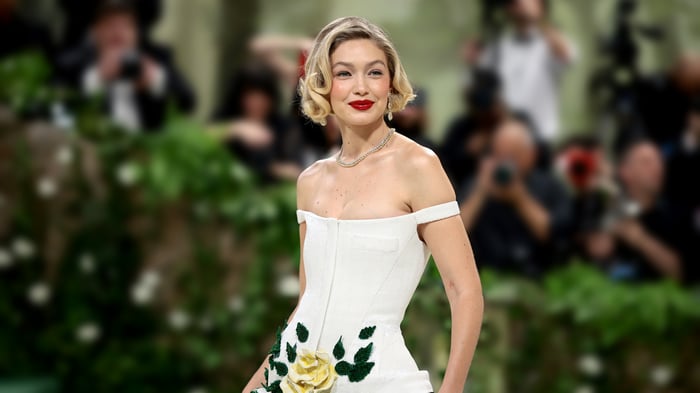 Gigi Hadid in a white corset dress with floral embellishments