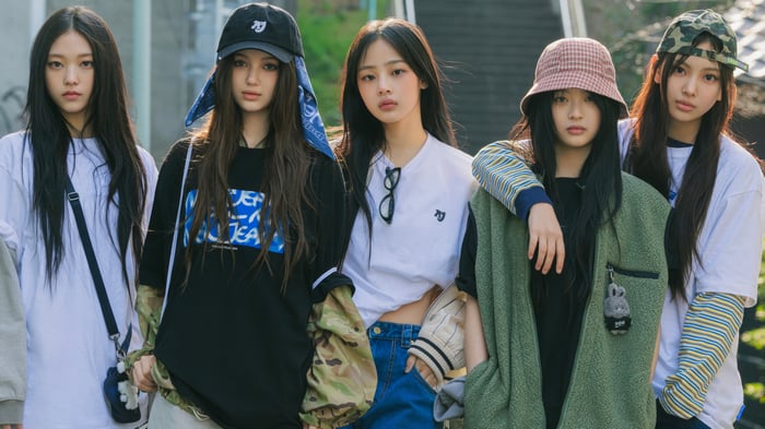 NewJeans members posing outdoors