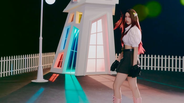 IVE Leeseo in a stylized setting with colorful lights