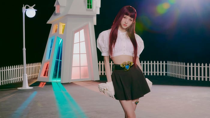 IVE Gaeul in a whimsical setting with colorful lights