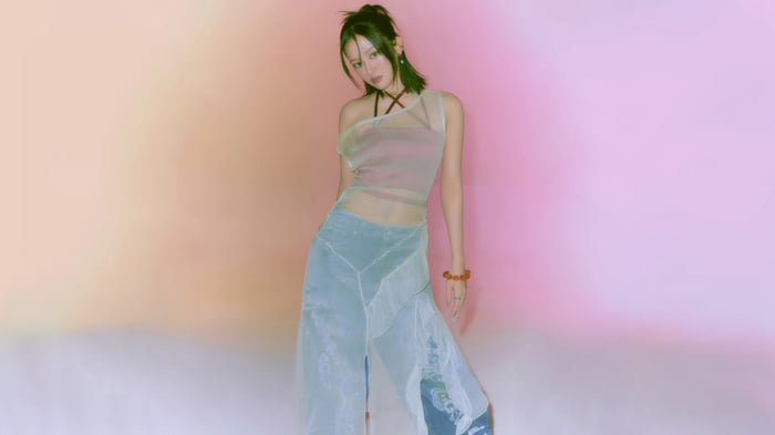 Yujin from IVE in a sheer top and wide-leg pants