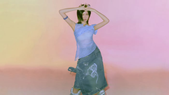 Gaeul from IVE in a blue top and denim skirt