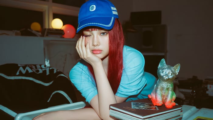 Hyein from NewJeans wearing a blue cap