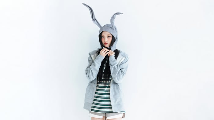 Haerin from NewJeans wearing a bunny hat