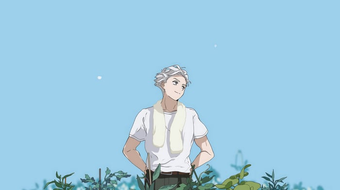 Hajime Umemiya in a field with plants