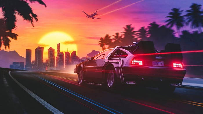 DeLorean driving on a road at sunset with city skyline