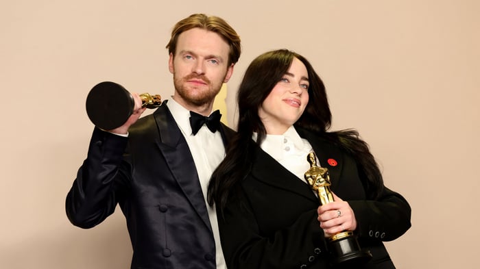 Billie Eilish and Finneas with Oscars