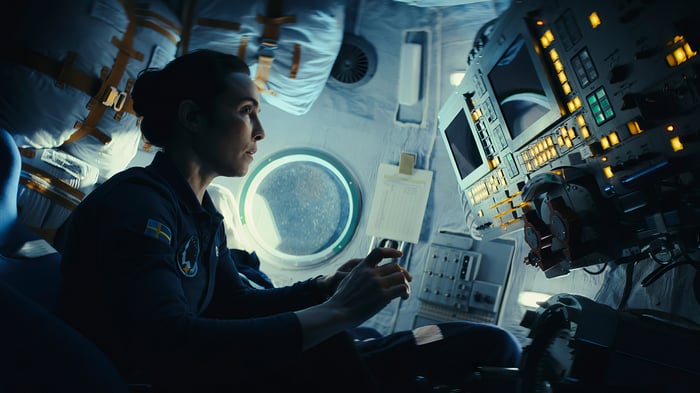 Astronaut Noomi Rapace in a spacecraft cockpit
