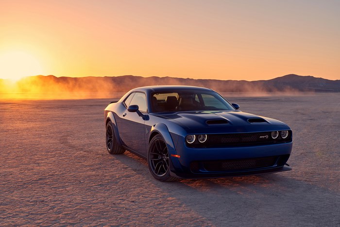 Blue Dodge Challenger SRT Hellcat in the desert at sunset