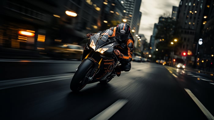 Motorcycle racing on a city street at night in 4K
