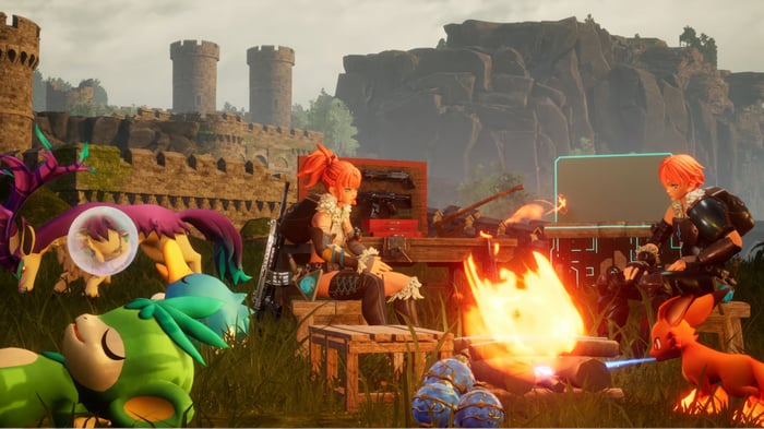 Palworld characters camping by a campfire