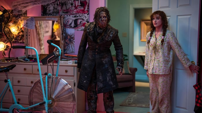 Lisa Frankenstein and a woman in pajamas