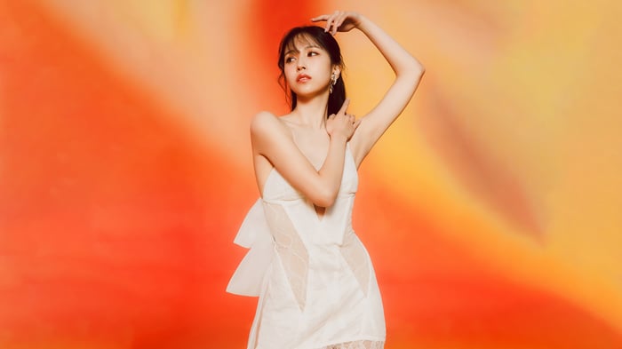 Mina from TWICE in a white dress