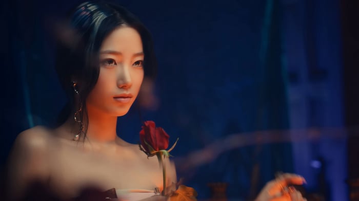 Kazuha from LE SSERAFIM with a rose