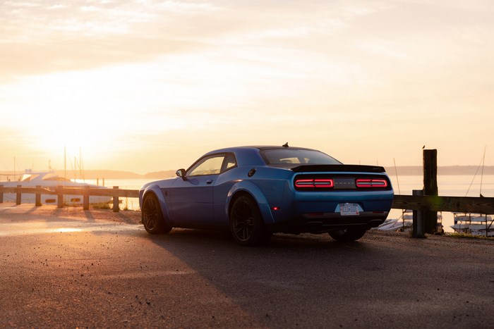 Blue Dodge Challenger SRT Hellcat at sunset by the water