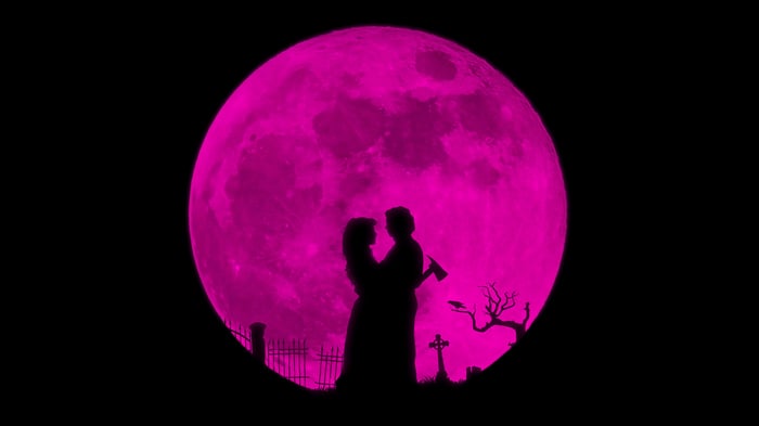 Lisa Frankenstein and a man with an axe under a pink moon