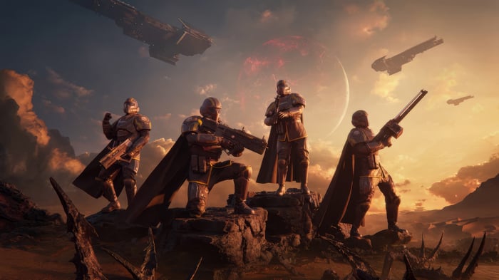 Helldivers 2 soldiers on alien planet with red moon