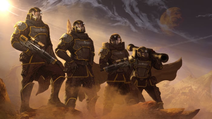 Four Helldivers soldiers in armor with weapons