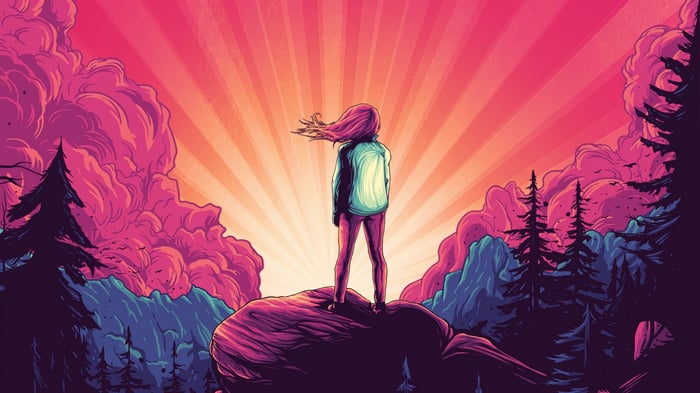 Person Standing on Rock During Sunrise