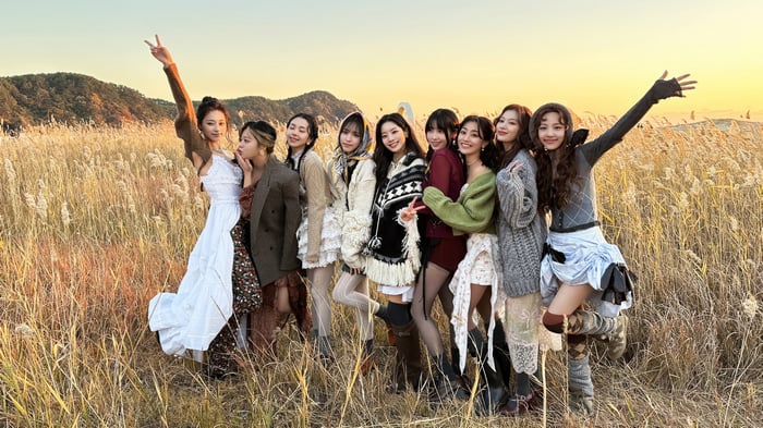 TWICE girls posing in a field at sunset 4K