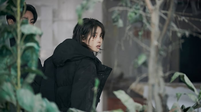 IU in a black puffer jacket
