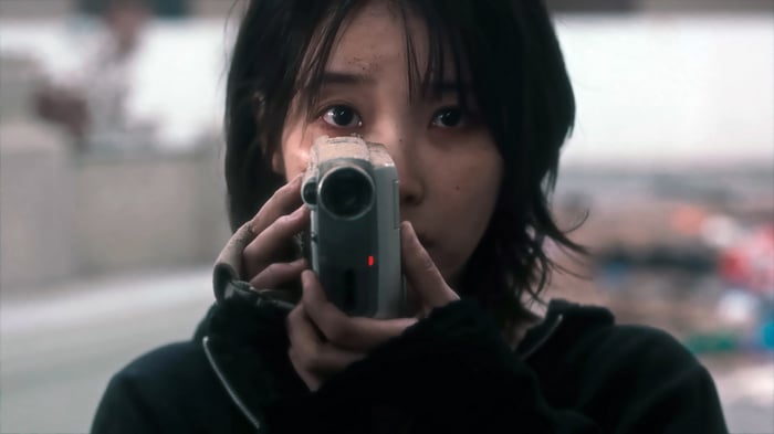 IU holding a camcorder in 4K
