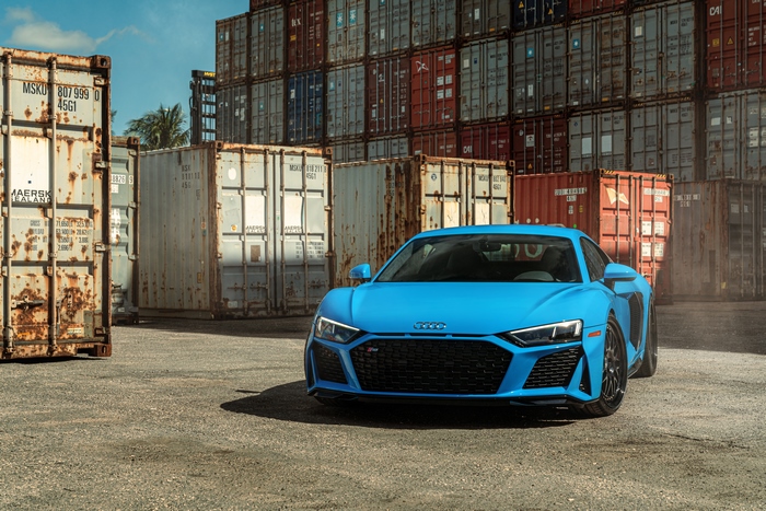 Blue Audi R8 Supercar in Shipping Container Yard