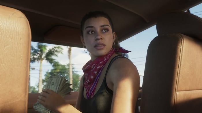 Woman in a car holding money in Grand Theft Auto 6