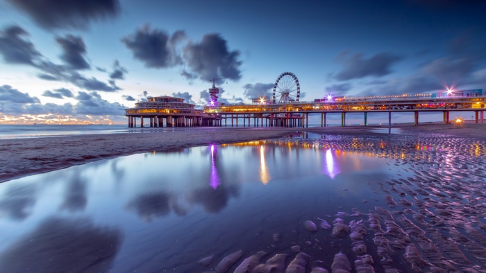 Scheveningen Pier at Night with Ferris Wheel and Reflection