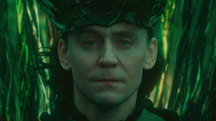 Loki in a green, leafy crown