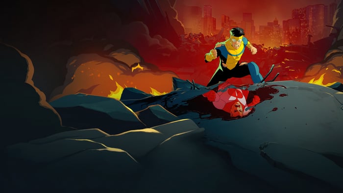 Invincible stands over a defeated opponent in a destroyed city