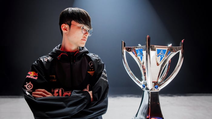 Faker with the League of Legends trophy