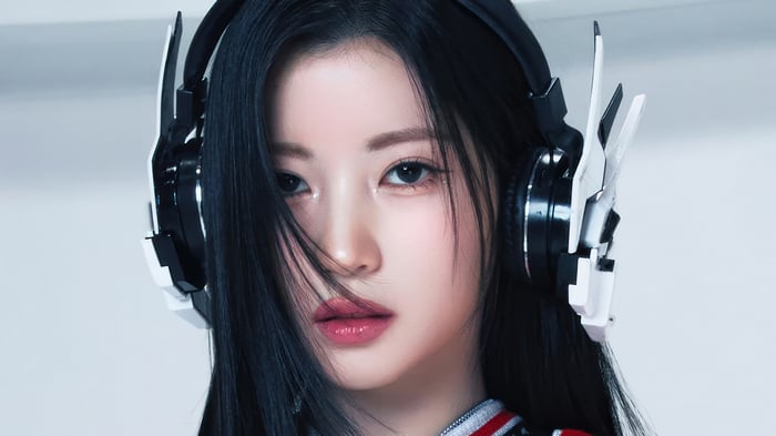 Asa from BabyMonster wearing headphones
