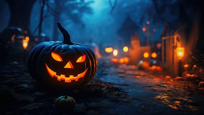 Halloween Jack-o'-lantern with glowing eyes in a spooky forest