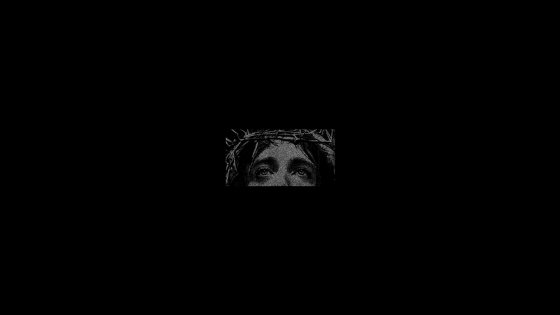 Close-up of Jesus Christs eyes wearing a crown of thorns