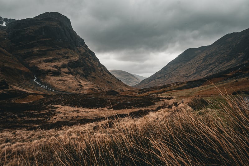 Gloomy Scottish Highlands with Mountains and Grass