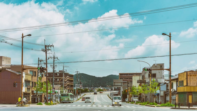 Cars and buses on a street in Kyoto, Japan
