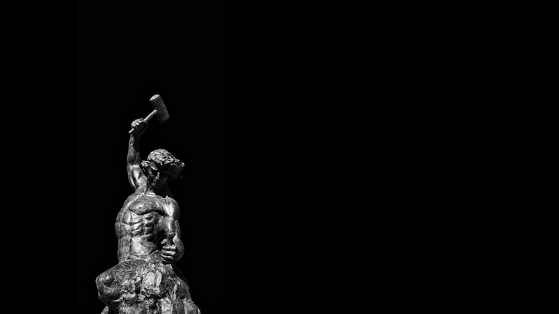 Sculpture of a man with a hammer