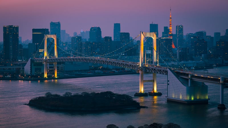 Rainbow Bridge and Tokyo skyline at dusk