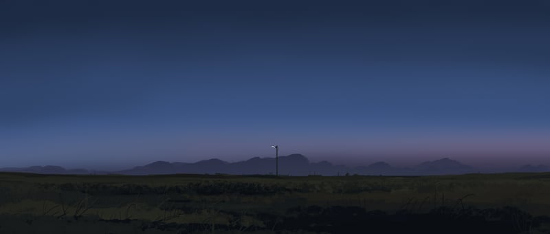 Street light on plains with mountains at dusk