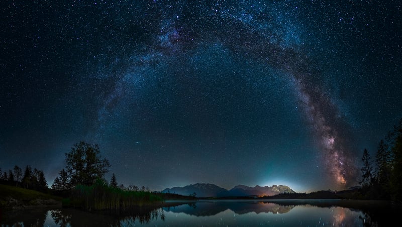 Milky Way Arch over a Lake and Mountains