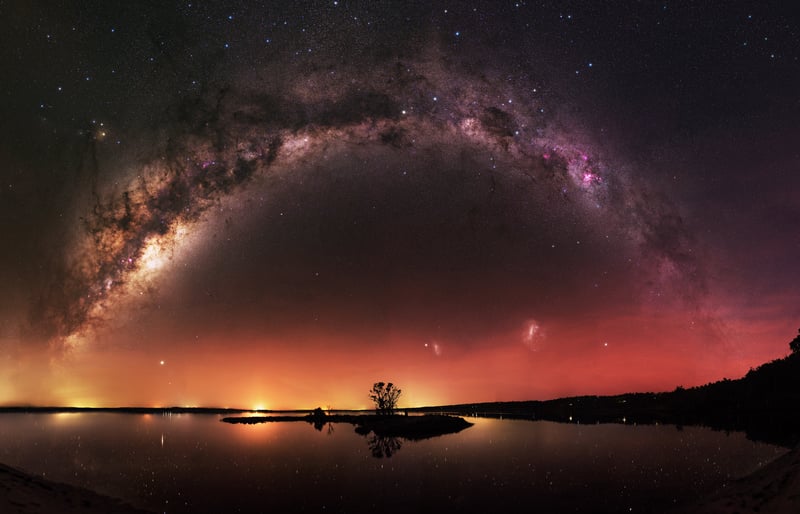 Milky Way Arch Over a Calm Lake at Night