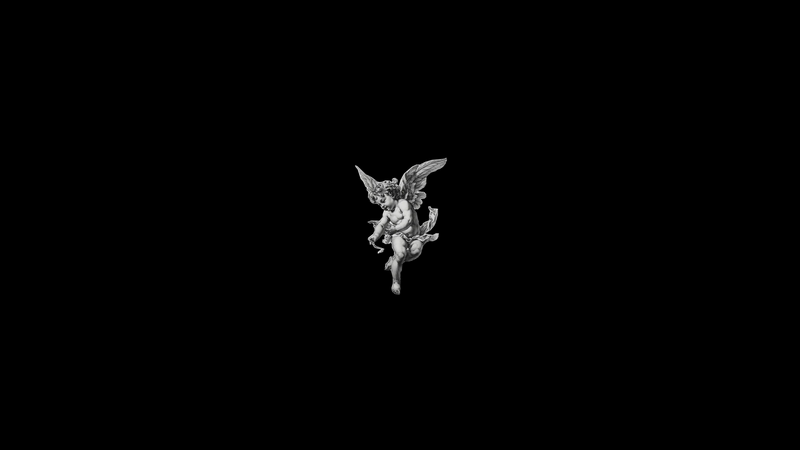 Cherub sculpture on a black background